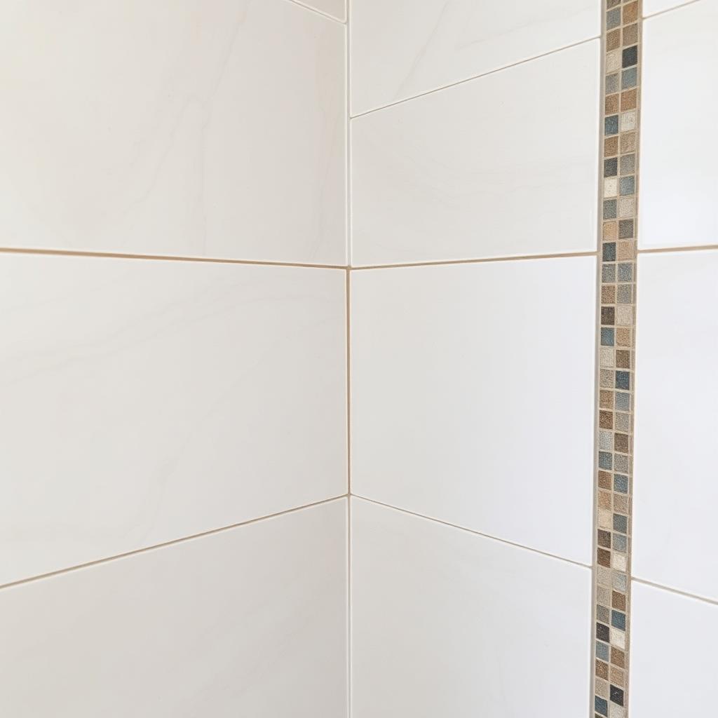Close-up of durable large-format porcelain tile and precision grout work in a Chicagoland bathroom